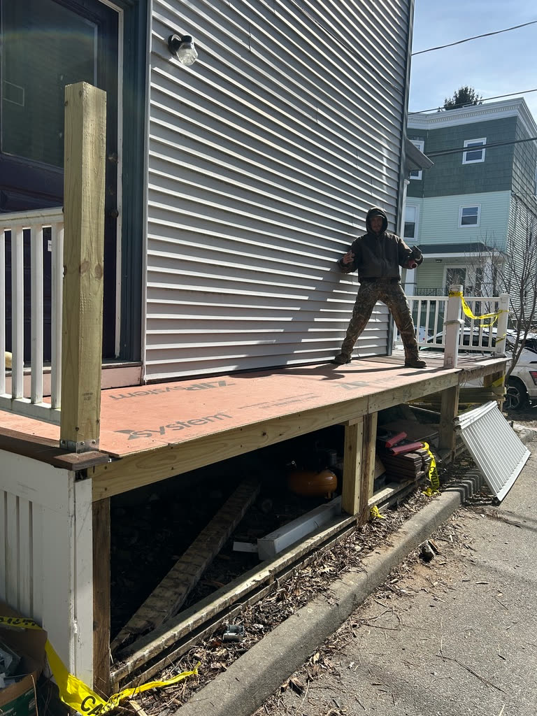 A new porch deck, framed and sheathed