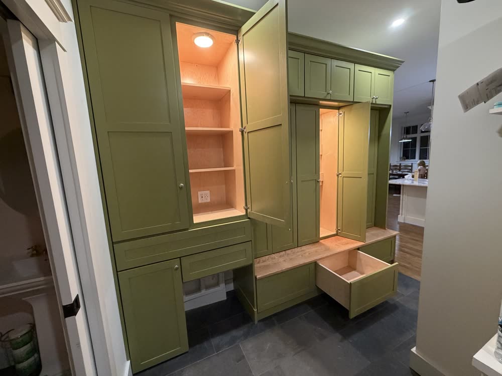 Built-in wall with a lit cabinet