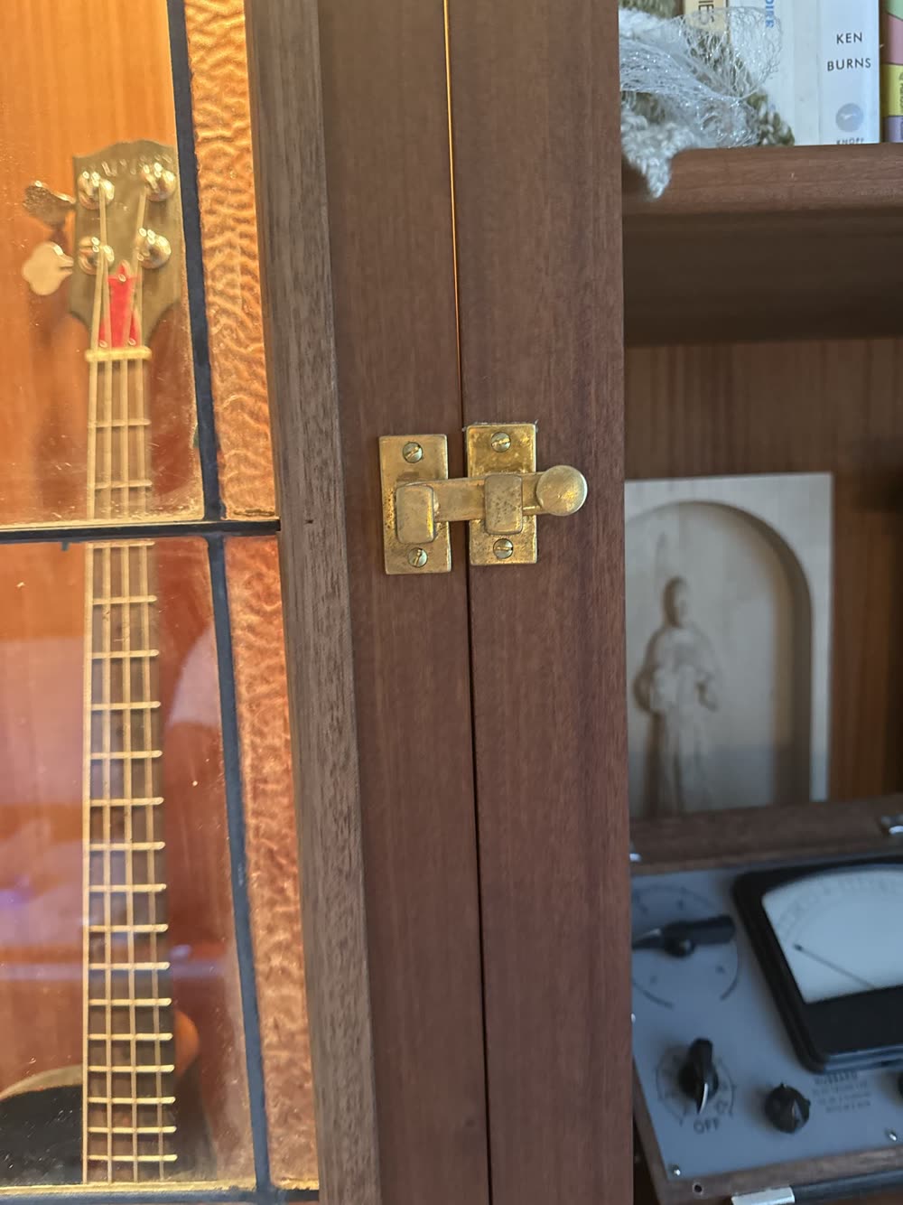 Hardware on a dark wood cabinet