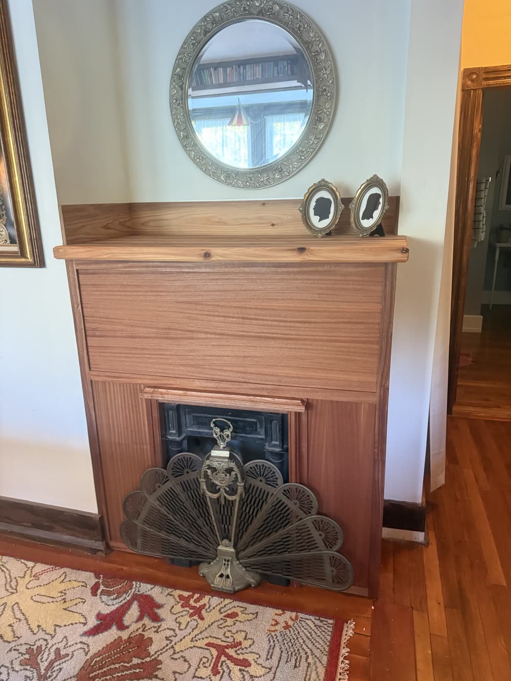 A wood fireplace surround and mantel by Harebell